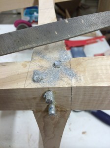 Filing the aluminum pins close