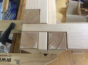 All the chamfers at the feet and rails.