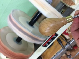 Finishing the parted end on the buffing wheel.